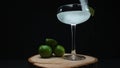 Macrography of margarita is captured in a glass with lime slice. Comestible. Royalty Free Stock Photo