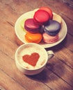 Macrons with cup of coffee Royalty Free Stock Photo