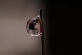 macrophotography of a drop of water attached to the tip of the syringe needle Royalty Free Stock Photo