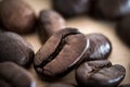 Macrophotography of real coffee beans on wooden background Royalty Free Stock Photo