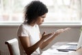 Mad biracial woman frustrated by computer operational problems Royalty Free Stock Photo