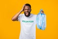 Mad African Volunteer Man Shouting Holding Garbage Bag, Yellow Background Royalty Free Stock Photo