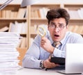 Mad auditor looking for errors in the report Royalty Free Stock Photo