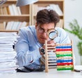 The mad auditor looking for errors in the report Royalty Free Stock Photo