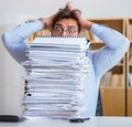 The mad businessman with piles of papers Royalty Free Stock Photo