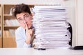 The mad businessman with piles of papers Royalty Free Stock Photo