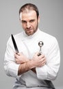 Mad Chef Holding Kitchen Tools Royalty Free Stock Photo