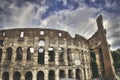 Mad clouds and Colisseum old building in Rome city, Italy Royalty Free Stock Photo