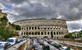 Mad clouds and Colisseum old building in Rome city, Italy Royalty Free Stock Photo