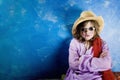 Mad Girl in a Hat and Glasses Royalty Free Stock Photo