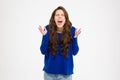 Mad hysterical woman with long curly hair standing and shouting Royalty Free Stock Photo