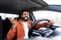 Mad indian man shouting while sitting in auto driver seat Royalty Free Stock Photo