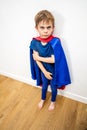 Mad little superhero child conflicted by parents for domestic violence Royalty Free Stock Photo