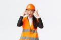 Mad and outraged asian female chief engineer, construction manager burst in rage, losing temper at employees, shouting