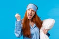Mad, outraged and furious redhead caucasian girl shouting, cursing roommate being too loud at night, cant sleep, shaking Royalty Free Stock Photo