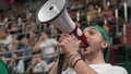 Mad people shouting megaphone sport tribune. Furious fan scream bullhorn stands. Royalty Free Stock Photo