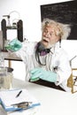 Mad scientist conducts chemistry experiment Royalty Free Stock Photo