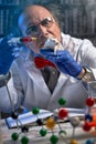 Mad scientist doing experiment on lab mouse Royalty Free Stock Photo