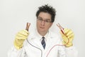 Mad scientist with battery clamps Royalty Free Stock Photo