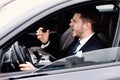 Mad young businessman driving alone in his new car Royalty Free Stock Photo
