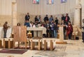 An international group of believers makes a group prayer service in Memorial Church of Moses on Mount Nebo near the city of Madaba