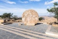 Rolling stone used as fortified door of a Byzantine monastery in Memorial Church of Moses on Mount Nebo near the city of Madaba in Royalty Free Stock Photo