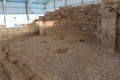 The ruins of houses and mosaic in the covered pavilion on the historical archaeological site Umm ar-Rasas near Madaba city in Jord