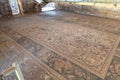 The ruins of houses and mosaic in the covered pavilion on the historical archaeological site Umm ar-Rasas near Madaba city in Jord