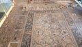 The ruins of houses and mosaic in the covered pavilion on the historical archaeological site Umm ar-Rasas near Madaba city in Jord