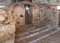 The ruins of houses and mosaic in the covered pavilion on the historical archaeological site Umm ar-Rasas near Madaba city in Jord