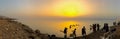 Madaba, Jordan - March 2018: People swimming in the Dead Sea at sunset in Jordan