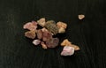 Madagascar or Pakistani Garnet natural unpolished mineral stone on a black background. Mineralogy, geology, magic of Royalty Free Stock Photo