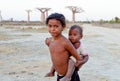 Madagascar-shy and poor african girl with infant