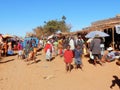 Madagascar village with busy lokal week market, population with colorful clothes