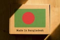 Made in Bangladesh. Cardboard boxes with text `Made In Bangladesh` and the Flag of Bangladesh. Royalty Free Stock Photo