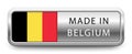 MADE IN BELGIUM metallic badge with national flag isolated on a white background.