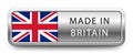 MADE IN BRITAIN metallic badge with national flag isolated on a white background.