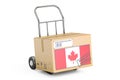 Made in Canada concept. Cardboard Box on Hand Truck, 3D rendering Royalty Free Stock Photo