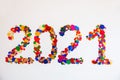 2021 made of confetti on white background. New Year idea