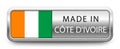 MADE IN COTE D`IVOIRE metallic badge with national flag isolated on white background