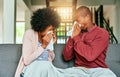 We made each other sick. a young couple blowing their noses at home. Royalty Free Stock Photo