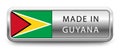 MADE IN GUYANA metallic badge with national flag isolated on a white background. Royalty Free Stock Photo