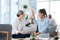 We made it happen. two businesswomen giving each other a high five while working together in an office. Royalty Free Stock Photo