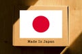 Made in Japan. Cardboard boxes with text `Made In Japan` and the Flag of Japan.