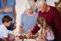 Made with love. a grandparents preparing a meal with their grandchildren. Royalty Free Stock Photo