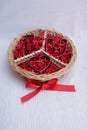 round wicker basket with peace logo symbol, red ribbon, I Heart love u cookie cutters Royalty Free Stock Photo