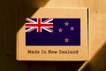 Made in New Zealand. Cardboard boxes with text `Made In New Zealand` and the Flag of New Zealand.