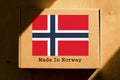 Made in Norway. Cardboard boxes with text `Made In Norway` and the Flag of Norway.