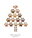 Made of paw print christmas tree with colorful paw print and cute dog. Christmas pine tree