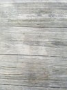 Wood texture background, closeup of table outdoors. Vertical planks. Surface has three large sections.